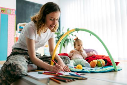 Military mom and her baby at home