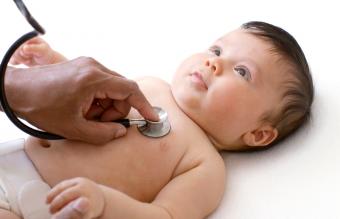 Doctor examining baby