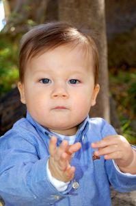 Baby making signs with hands