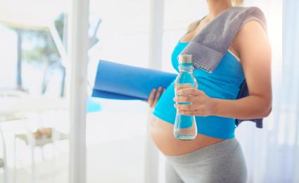 Pregnant woman getting ready to workout at home