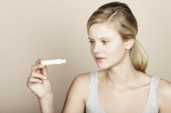 Woman looking at pregnancy test