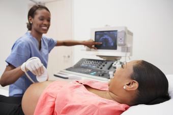 Pregnant African woman having ultrasound 