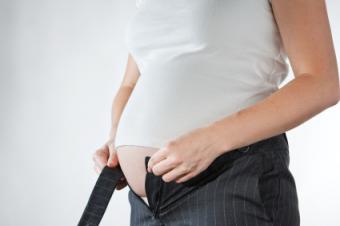 Pregnant woman's pants no longer fit