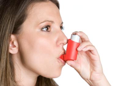 Image of woman using an inhaler during pregnancy