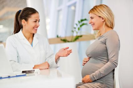 Pregnant woman talking with her Ob/Gyn