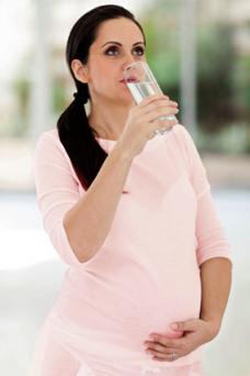 Pregnant woman drinking water