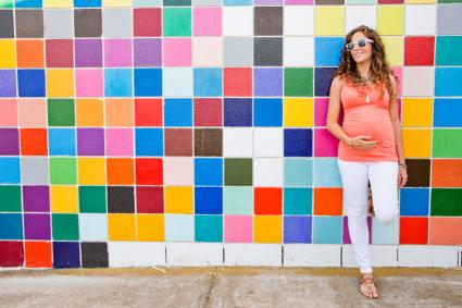 Young woman wearing trendy maternity clothes