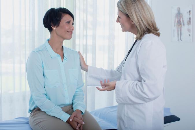 Doctor talking with female patient