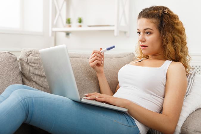 Woman with pregnancy tester