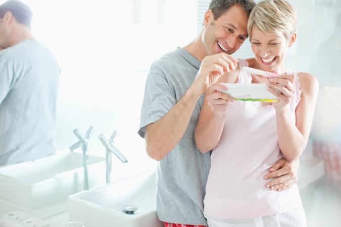 Couple reading home pregnancy test