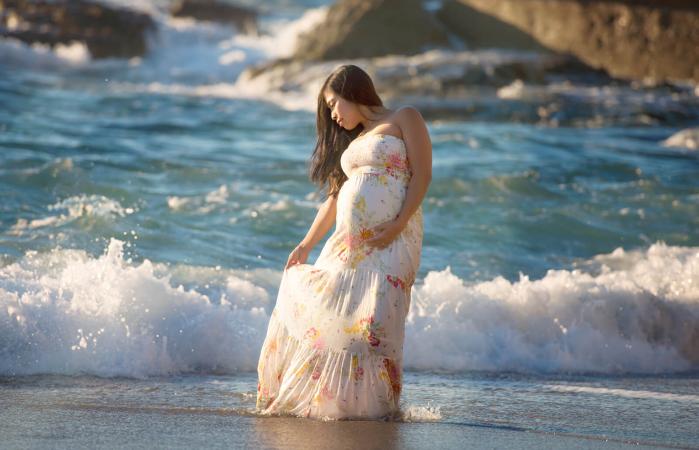 Pregnant woman in a fabulous maxi dress