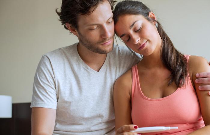 Couple looking at pregnancy test