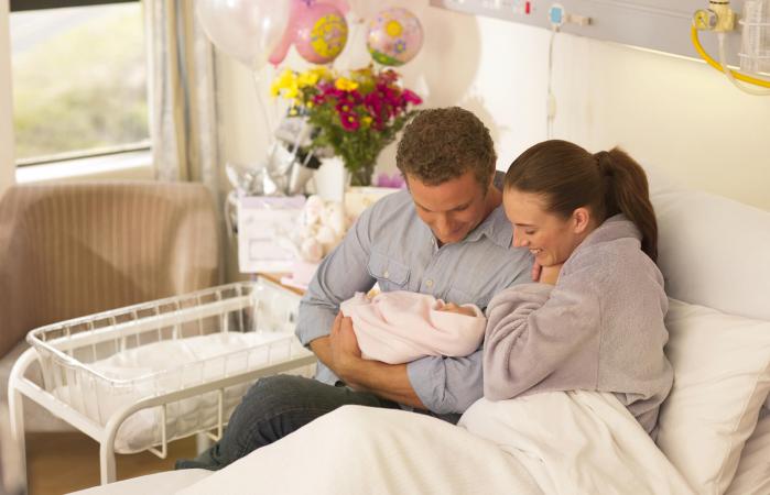Couple holding newborn baby