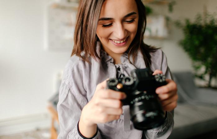 Photographer checking photos on a camera