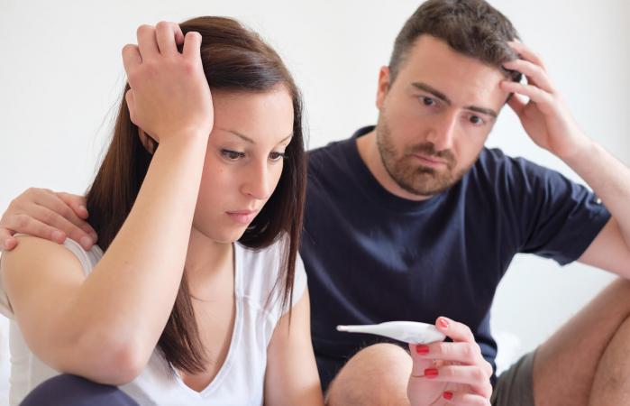 Sad couple after pregnancy test result