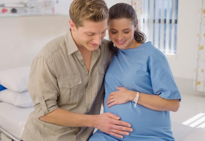 Pregnant woman and husband in hospital