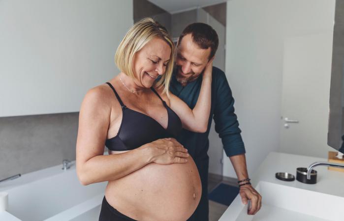 Happy mature pregnant couple