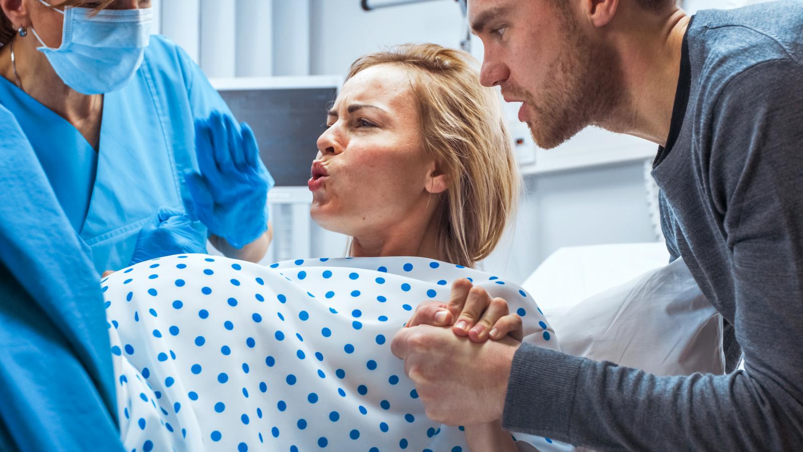 Woman in Labor Pushing Hard to Give Birth