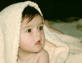Image of a baby under a blanket