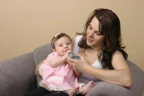 Image of a single mom holding her baby
