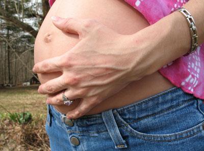 Pregnant woman in need of maternity jeans