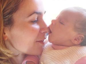Mother bonding with newborn baby