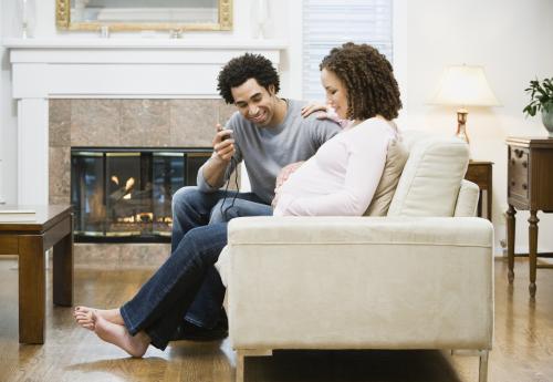Man timing his partner's contractions