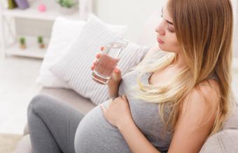 Pregnant woman drinking water