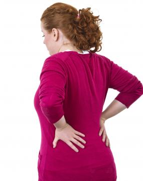 Young woman with lower back pain
