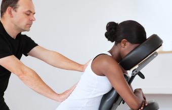 Pregnant woman getting a chair massage