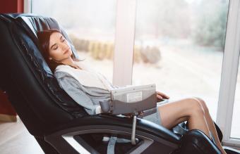 Woman relaxing on the massaging chair