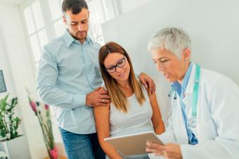 Couple And Doctor In Consultation