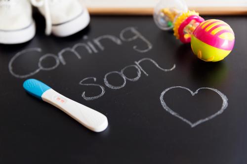 baby coming soon sign on chalkboard