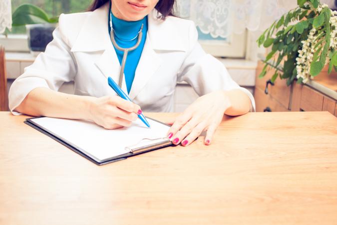 doctor writing note