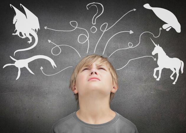 Boy thinking about an animal logic puzzle