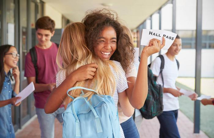 Two girls with hall passes