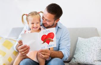 Daughter giving Dad a card and poem