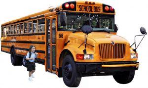 Girl getting on a school bus