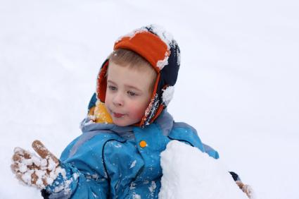 Preschooler playing in the snow
