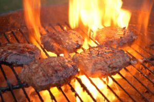 Hamburgers cooking on a grill