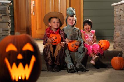 Children in costumes on Halloween night