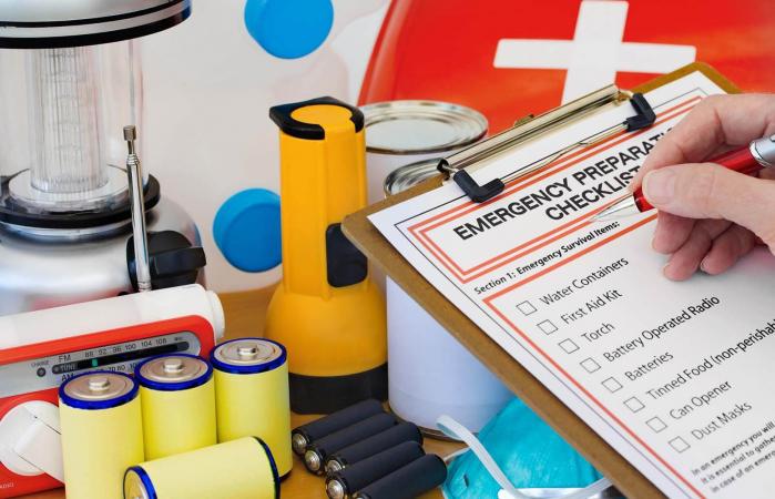 Hand completing Emergency Preparation List
