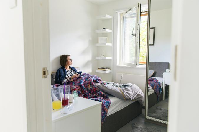 Woman in bed with the flu