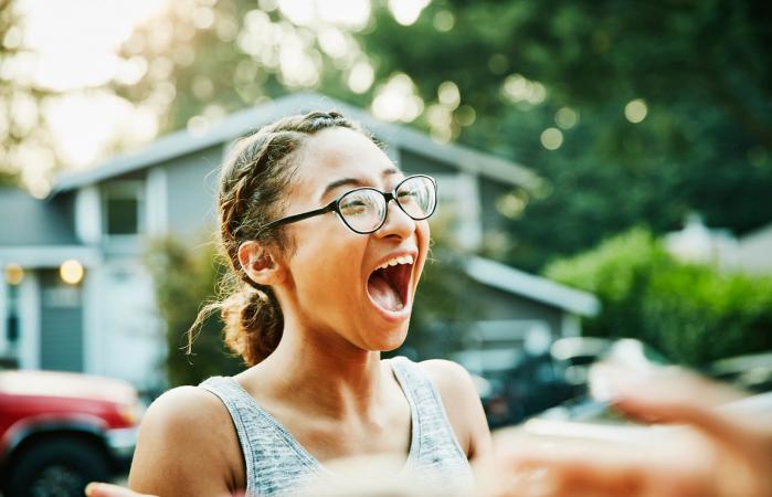 Laughing teen with friends