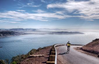 Lone biker turning corner