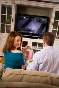 Couple enjoying their entertainment center