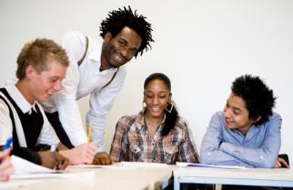 African American teacher working with students