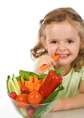 Child eating fresh vegetables