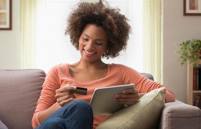 Woman online shopping using a tablet