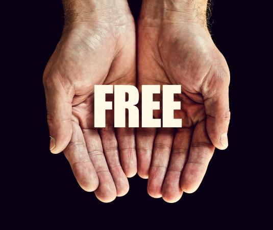 Hands holding the word free